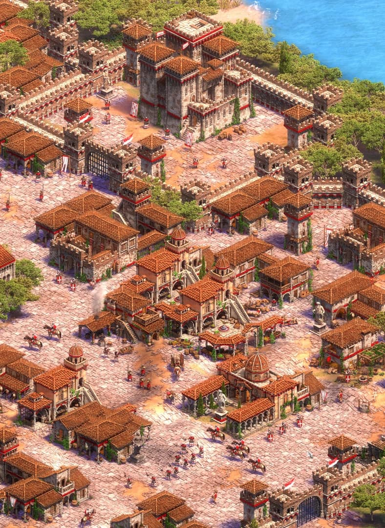 Age of Empires II castle overlooking a walled city with red-tiled roofs